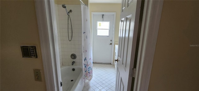 bathroom with shower / tub combo with curtain