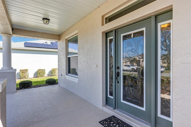 doorway to property with a patio