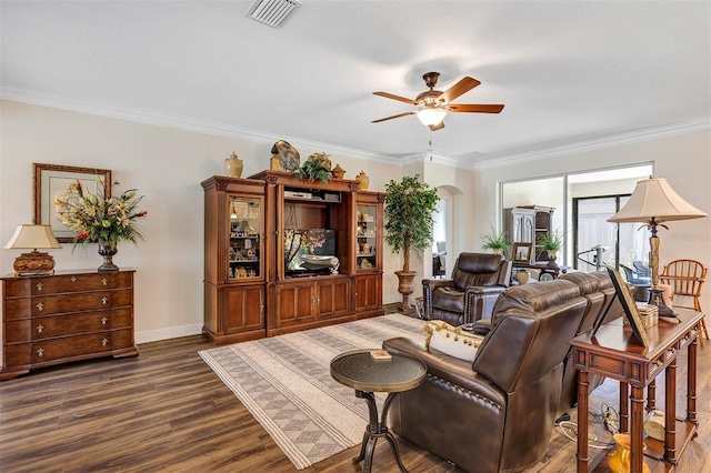 living room featuring ornamental molding, dark hardwood / wood-style floors, and ceiling fan