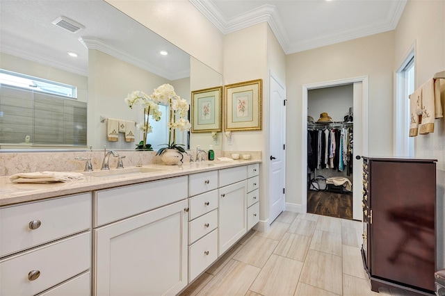 bathroom featuring a shower, vanity, hardwood / wood-style floors, and crown molding