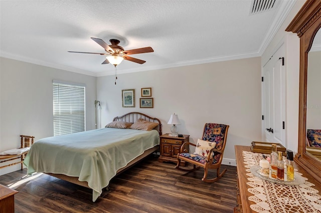 bedroom featuring a textured ceiling, crown molding, ceiling fan, and dark hardwood / wood-style floors