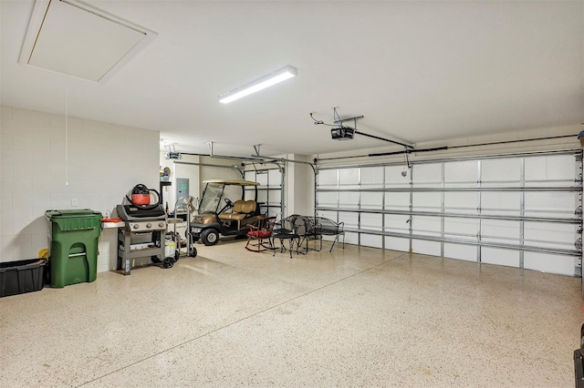 garage featuring a garage door opener