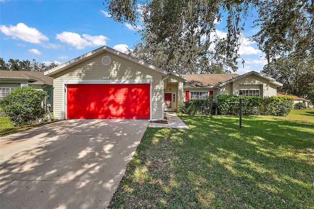 single story home featuring a garage and a front lawn