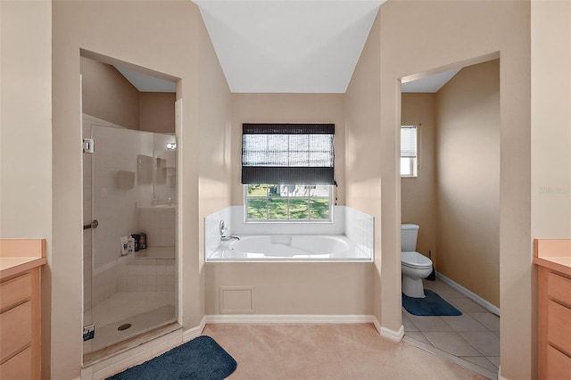 full bathroom featuring vanity, vaulted ceiling, independent shower and bath, and toilet