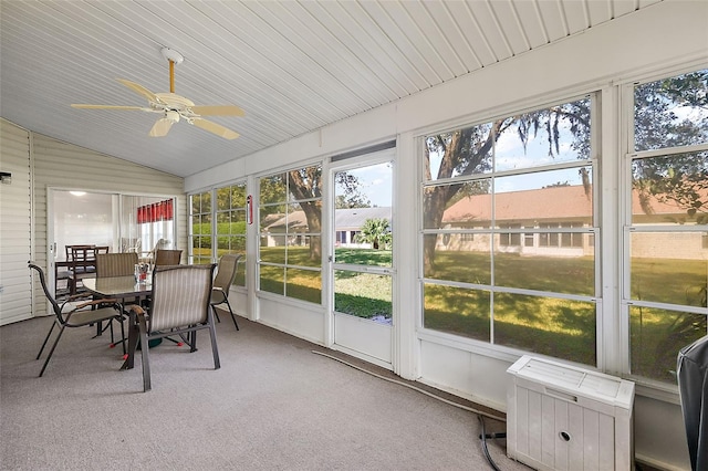 sunroom / solarium with ceiling fan and lofted ceiling