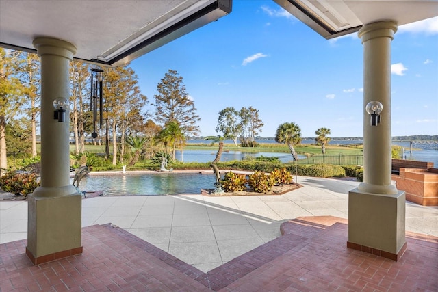 view of patio / terrace with a water view