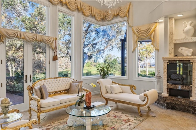 sunroom / solarium with a high end fireplace