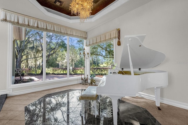 17601 Sawgrass Run, Tavares, FL 32778 - living area featuring a tray ceiling, a chandelier, crown molding, baseboards, and tile patterned floors