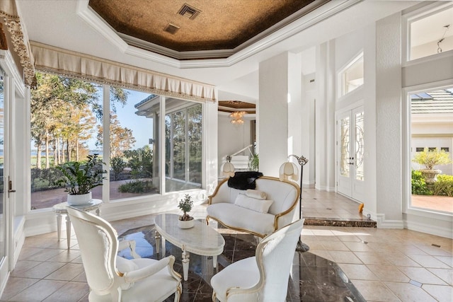 17601 Sawgrass Run, Tavares, FL 32778 - sunroom with french doors, a tray ceiling, ornamental molding, baseboards, and tile patterned flooring