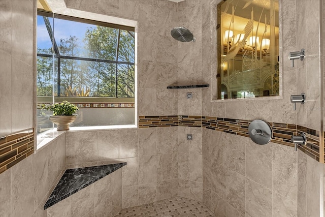 bathroom with tiled shower