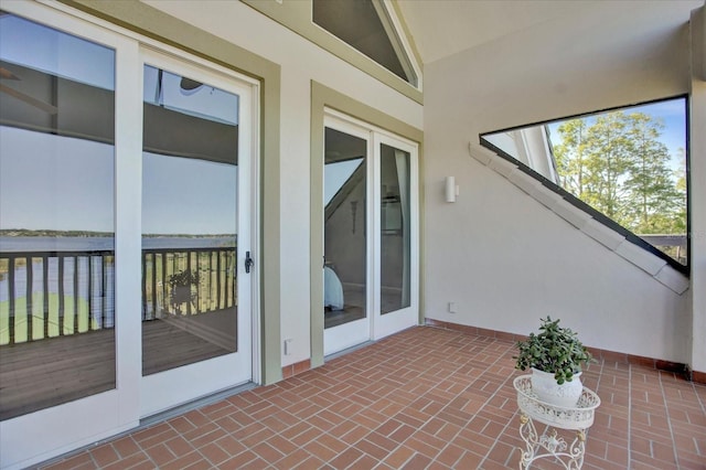 unfurnished sunroom with vaulted ceiling