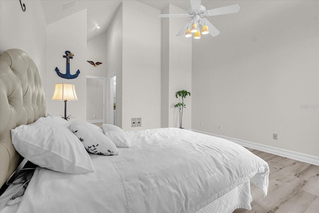 17601 Sawgrass Run, Tavares, FL 32778 - bedroom with wood finished floors, baseboards, and a towering ceiling