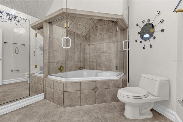 bathroom featuring tile patterned flooring, toilet, a textured ceiling, and shower with separate bathtub