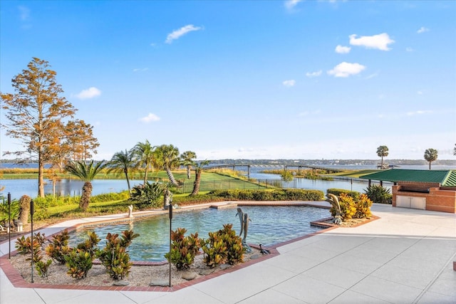 view of pool with a water view