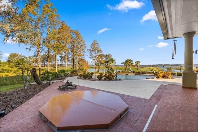 view of patio featuring a water view