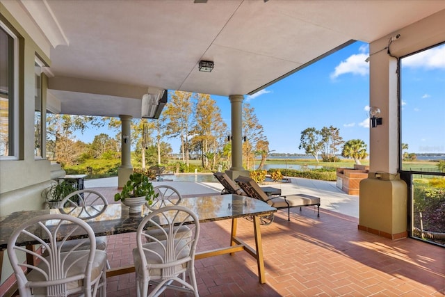 view of patio with a water view