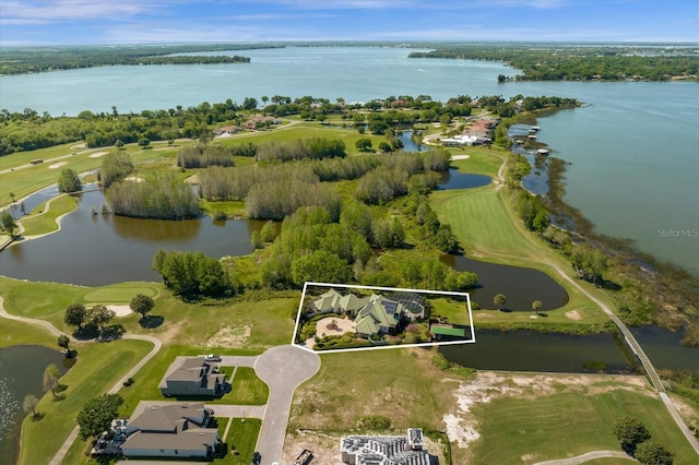 17601 Sawgrass Run, Tavares, FL 32778 - aerial view of property's location featuring a nearby body of water, property boundaries highlighted, and a local golf course