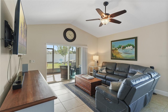 living area featuring lofted ceiling, light tile patterned flooring, ceiling fan, and baseboards