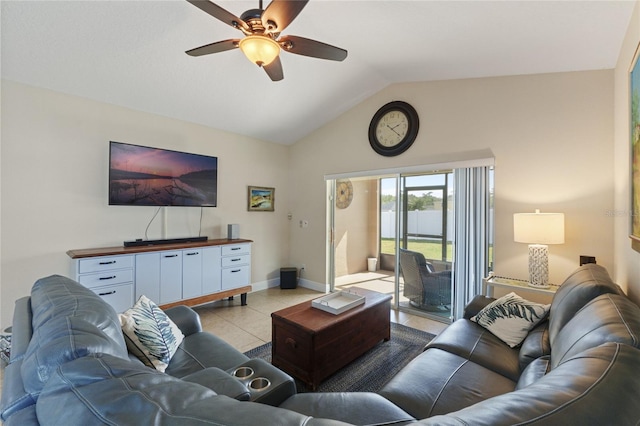 living area with lofted ceiling, light tile patterned flooring, ceiling fan, and baseboards