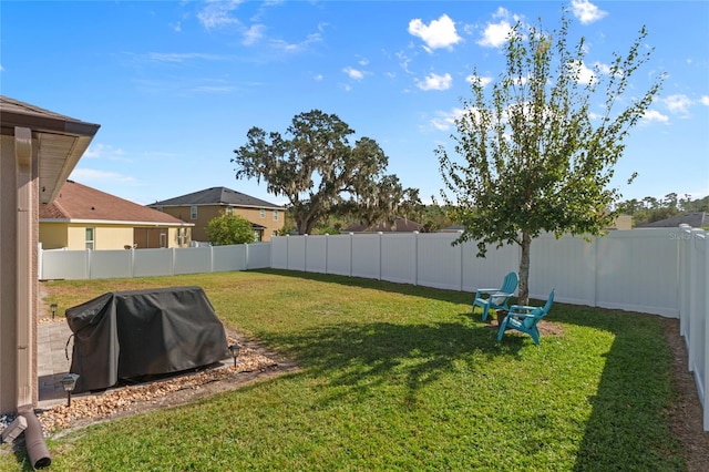 view of yard with a fenced backyard