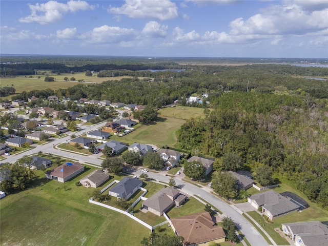 bird's eye view featuring a residential view and a view of trees