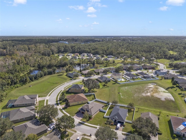 aerial view featuring a forest view and a residential view