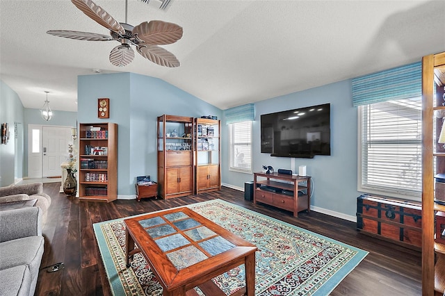 living room featuring dark hardwood / wood-style flooring, a textured ceiling, ceiling fan, and vaulted ceiling