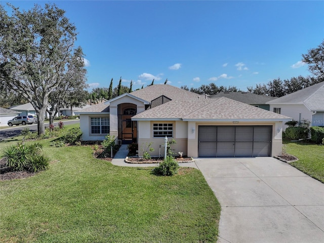 ranch-style home featuring a garage and a front lawn