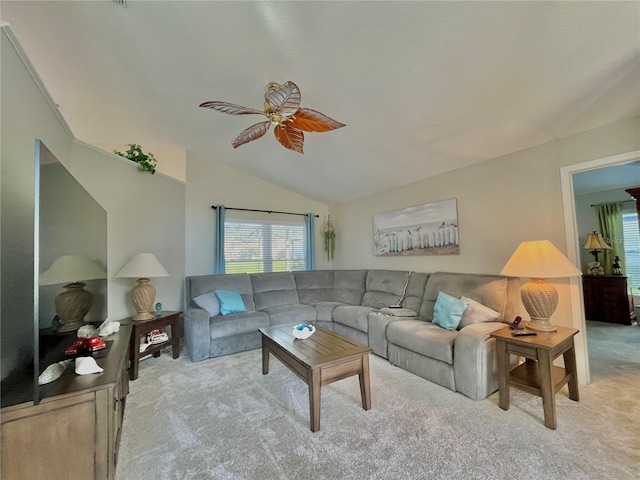 carpeted living room with lofted ceiling and ceiling fan