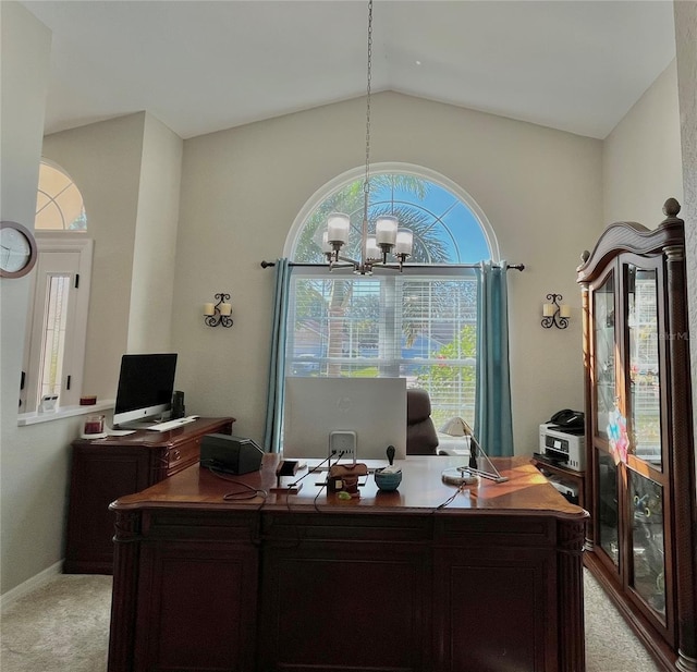 carpeted office featuring lofted ceiling and an inviting chandelier