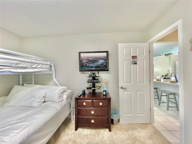 carpeted bedroom featuring a textured ceiling