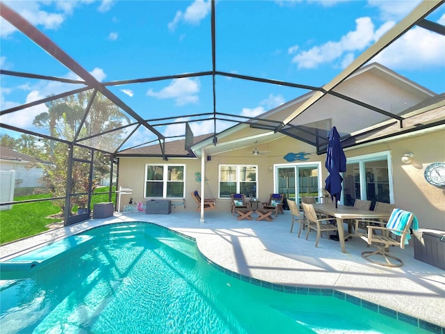 view of pool with a patio, a lanai, central AC unit, and ceiling fan