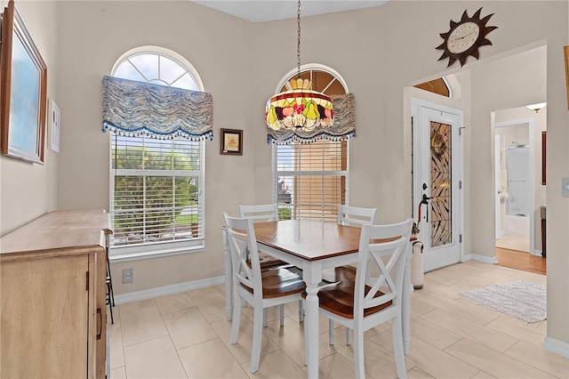 dining room featuring a notable chandelier and a wealth of natural light