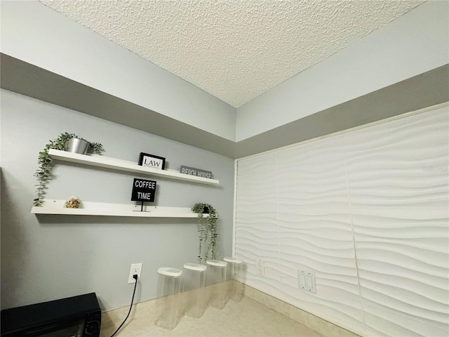 interior space featuring a textured ceiling