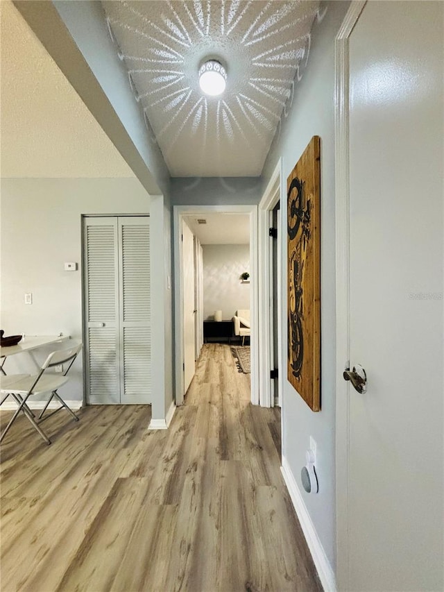 corridor featuring light wood-type flooring