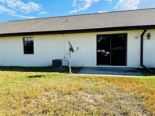 rear view of house with a patio area and a yard