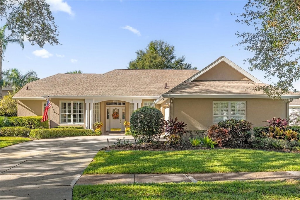 ranch-style house with a front lawn