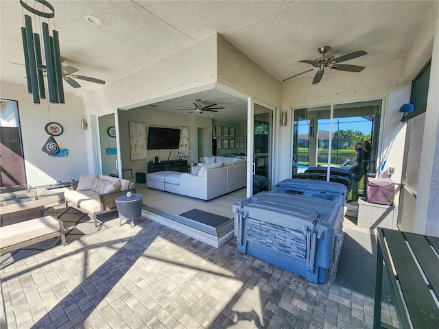 view of patio / terrace with outdoor lounge area and ceiling fan