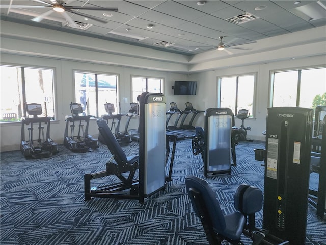 exercise room with carpet floors and ceiling fan