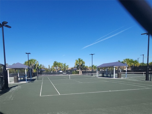 view of tennis court with a gazebo