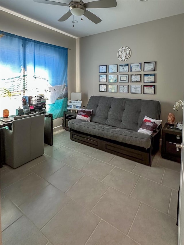 living room with ceiling fan and light tile patterned flooring