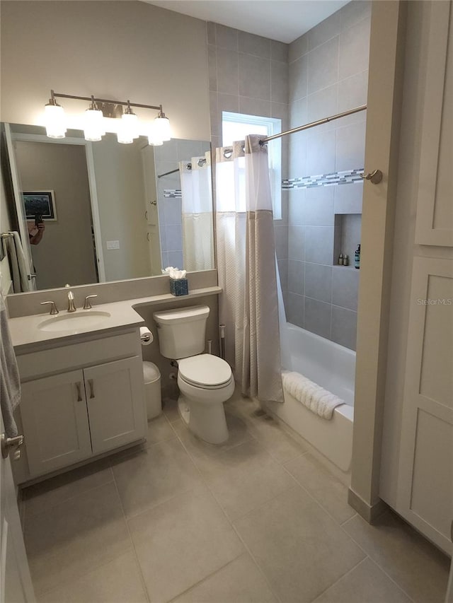 full bathroom with toilet, shower / tub combo with curtain, vanity, and tile patterned flooring