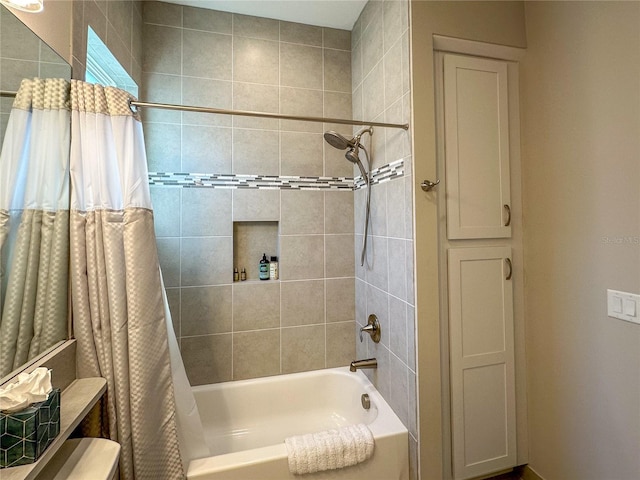 bathroom with shower / tub combo and toilet