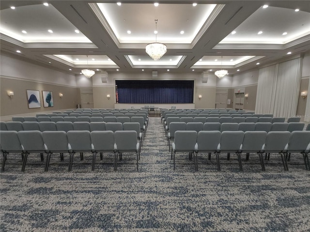 cinema with beamed ceiling, a chandelier, coffered ceiling, and dark carpet