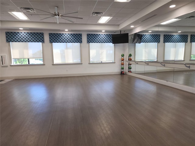 interior space with dark hardwood / wood-style floors and a paneled ceiling