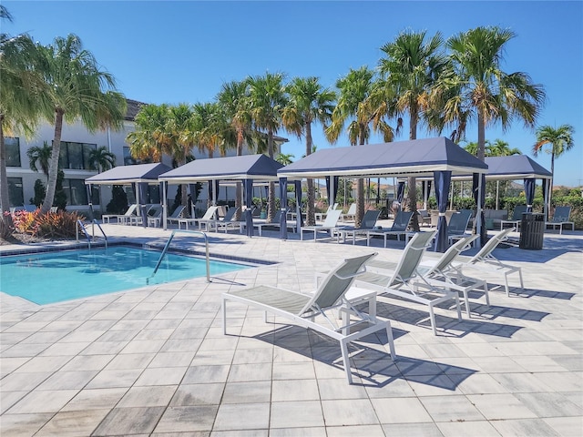 view of swimming pool featuring a patio and a gazebo