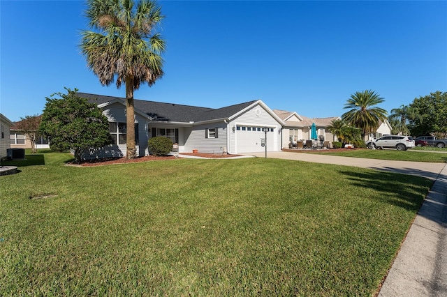 single story home featuring central air condition unit, a front yard, and a garage