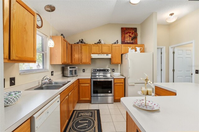 kitchen featuring white appliances, sink, a textured ceiling, hanging light fixtures, and lofted ceiling