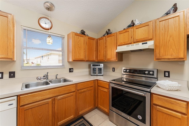 kitchen featuring sink, stainless steel electric range, decorative light fixtures, light tile patterned floors, and a textured ceiling