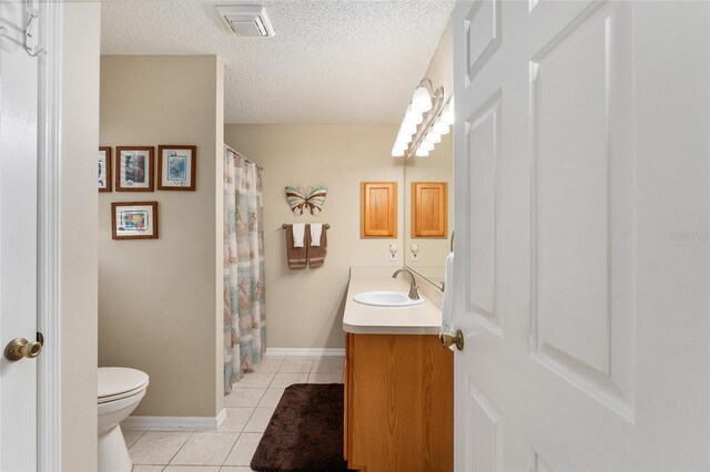 1312 Landeros Ln, The Villages, FL 32159 - full bath featuring a textured ceiling, visible vents, tile patterned flooring, vanity, and toilet